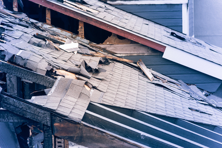 damaged apartment building after burned by fire